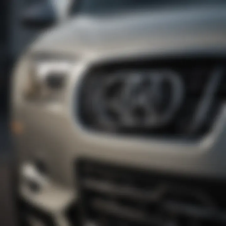 Close-up of Audi Fairfield certified pre-owned emblem on luxurious vehicle