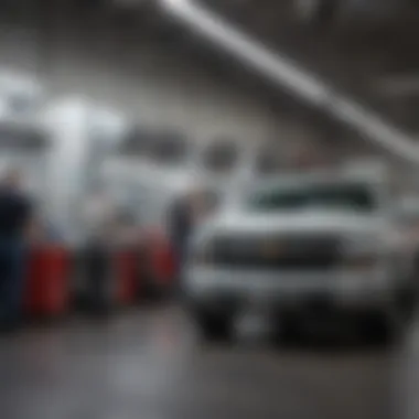 Service department with technicians working on vehicles