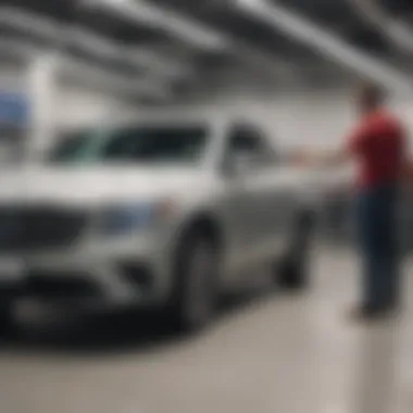 Carmax staff assisting a customer in showroom