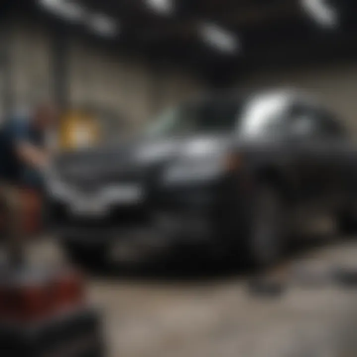 Service technician performing maintenance on a Lincoln vehicle