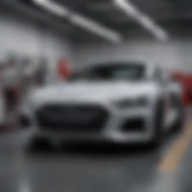 Service department with technicians working on Audi vehicles