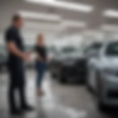 A customer interacting with a sales representative at AutoNation USA.