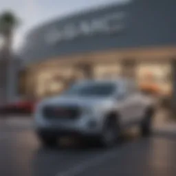 Exterior view of a GMC dealership showcasing diverse vehicle inventory