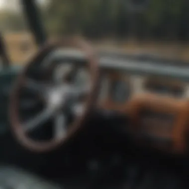 A detailed interior shot showing the classic dashboard and steering wheel of a Jeep.