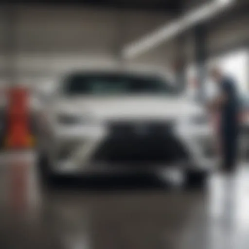 Service technician inspecting a luxury vehicle in the garage