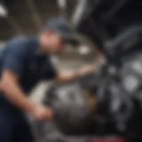 A technician inspecting a car's engine