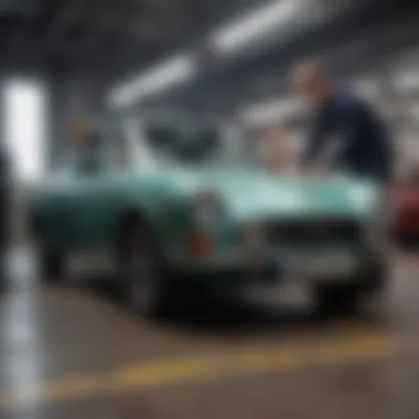 Technician performing detailed inspection on an IRA Tewksbury pre-owned car