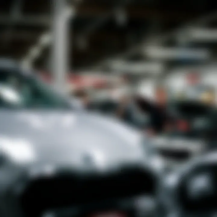 Service department with technicians working on Kia vehicles