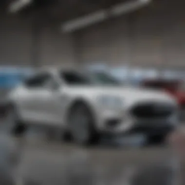 A sleek modern vehicle displayed prominently in a dealership showroom.