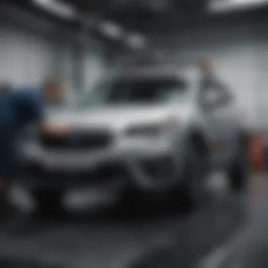 Mechanic performing maintenance on a Subaru vehicle