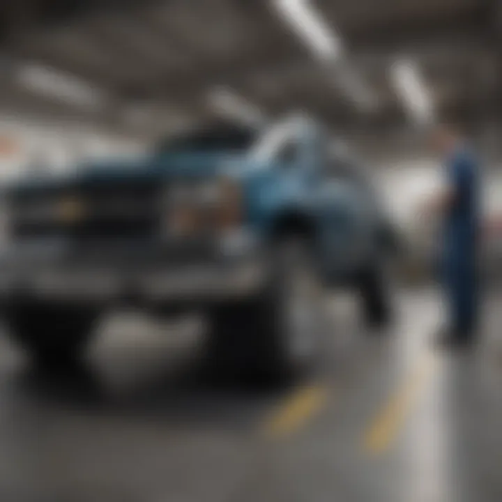 Skilled technicians working on a Chevrolet vehicle at Dave Kirk Chevrolet service center