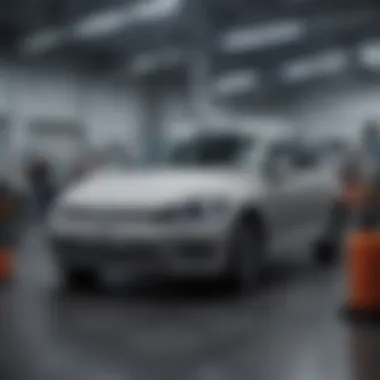 Service center with automotive technicians working on vehicles in VW Portsmouth