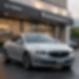 Luxury Buick sedan parked in front of Westcott Buick GMC showroom